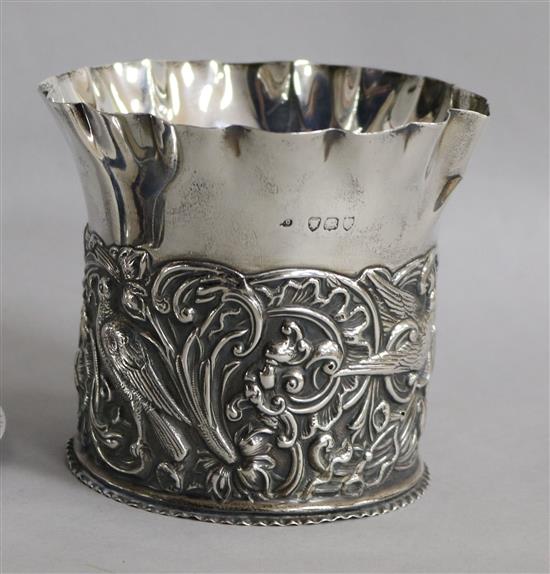 A Victorian repousse silver bottle coaster by William Comyns, London, 1892, 4.5 oz.